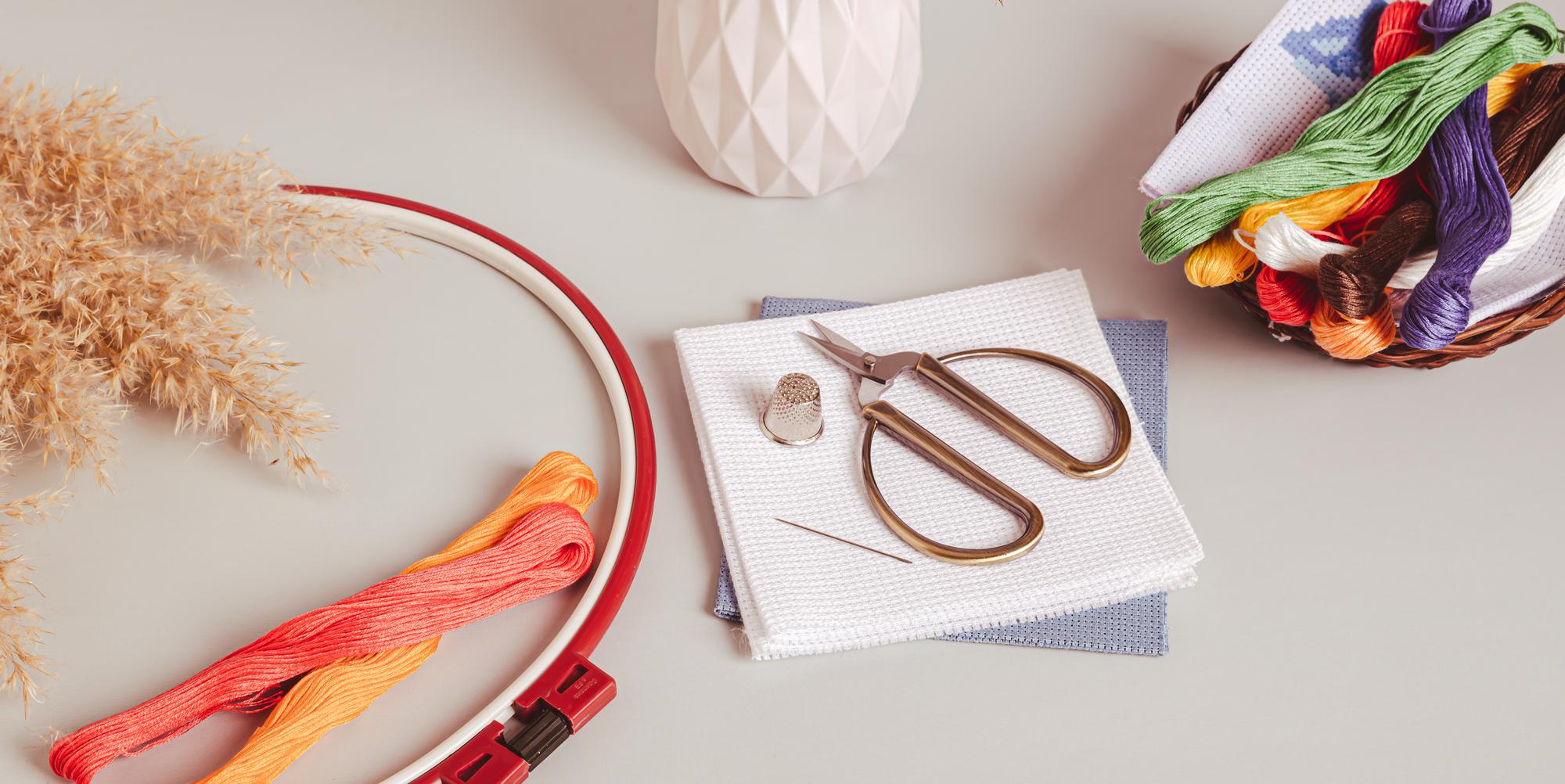 Curated embroidery workspace with threads and hoop